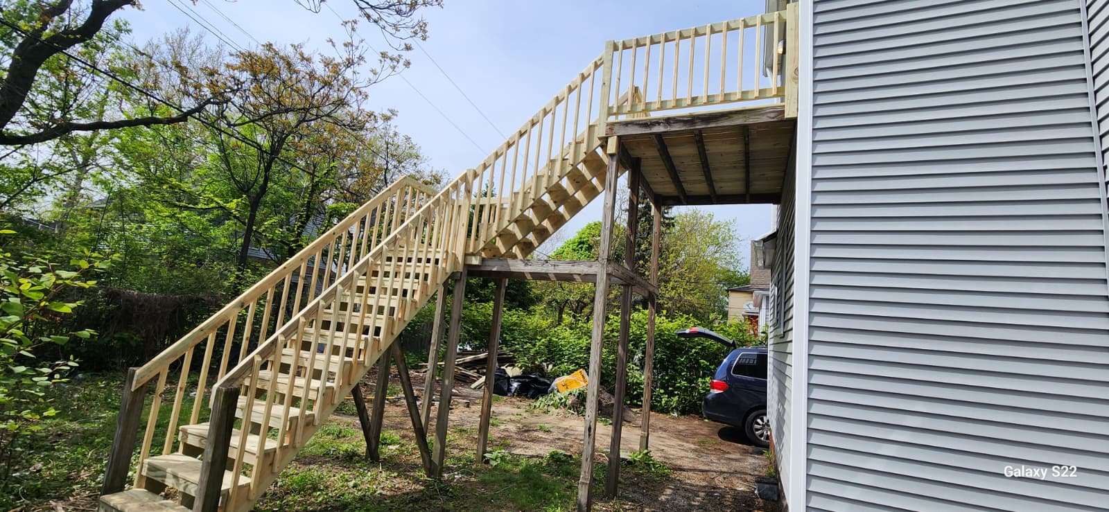 Exterior wood staircase and landing under construction