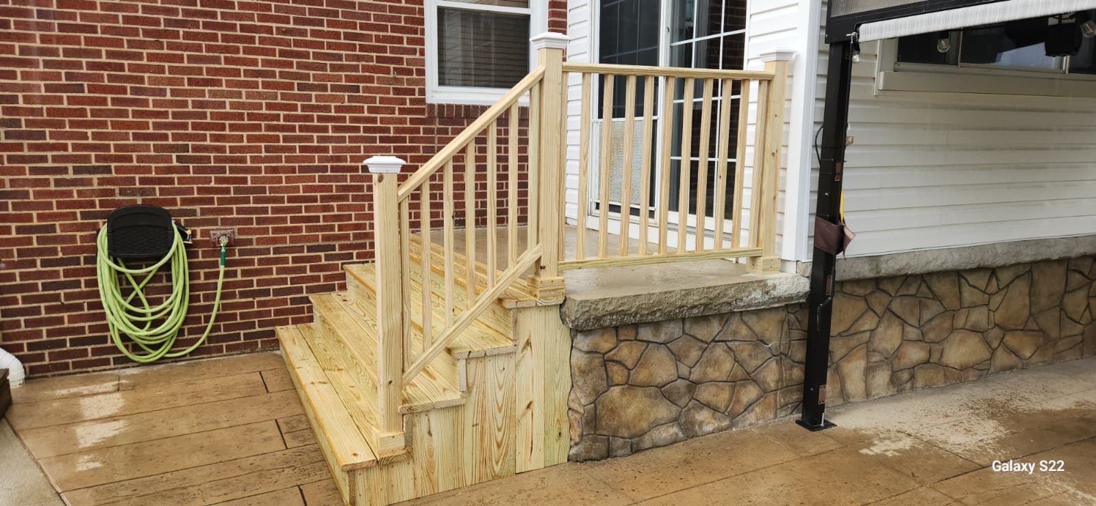 Freshly built wood entry steps and railing