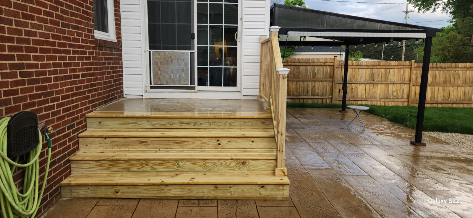 New wood back entry stairs and landing after installation